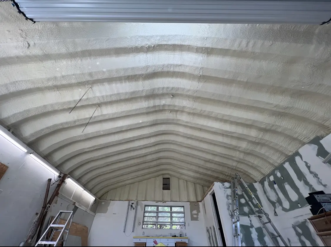 Spray polyurethane foam applied to the underside of a metal roof deck in Fairview Shores